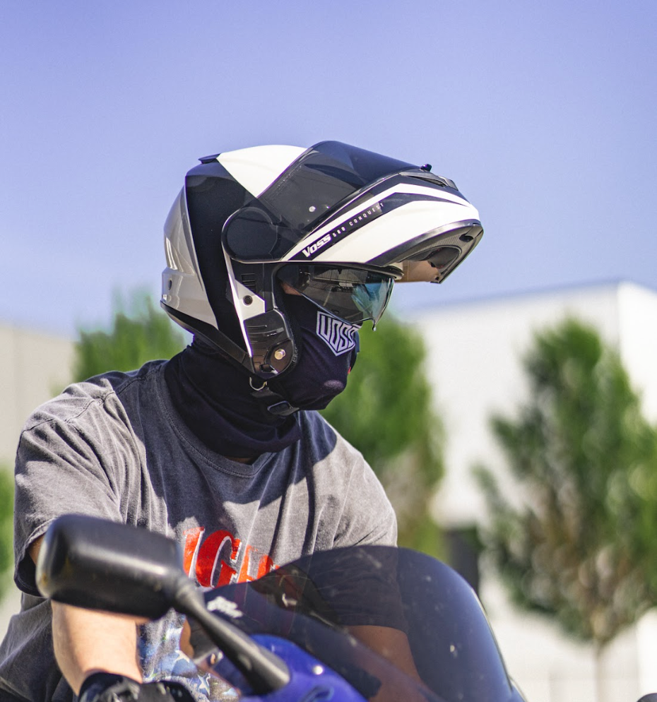 motorcycle rider wears a modular helmet 