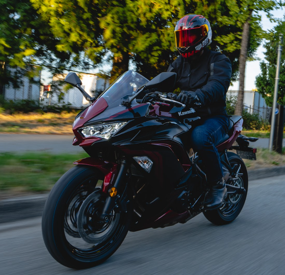 motorcycle rider riding a kawasaki ninja sportbike